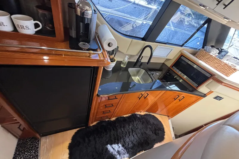 Mr & Mrs Smith Yacht Photos Pics Luxurious kitchen area in a 2003 Carver 450 Voyager Pilothouse yacht with modern amenities.