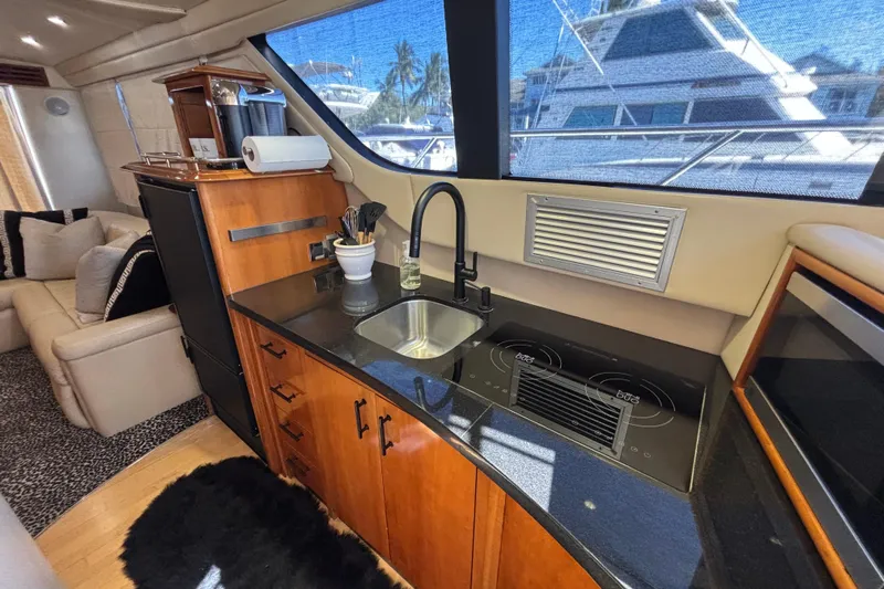 Mr & Mrs Smith Yacht Photos Pics Luxurious 2003 Carver 450 Voyager Pilothouse yacht interior with modern kitchen amenities.