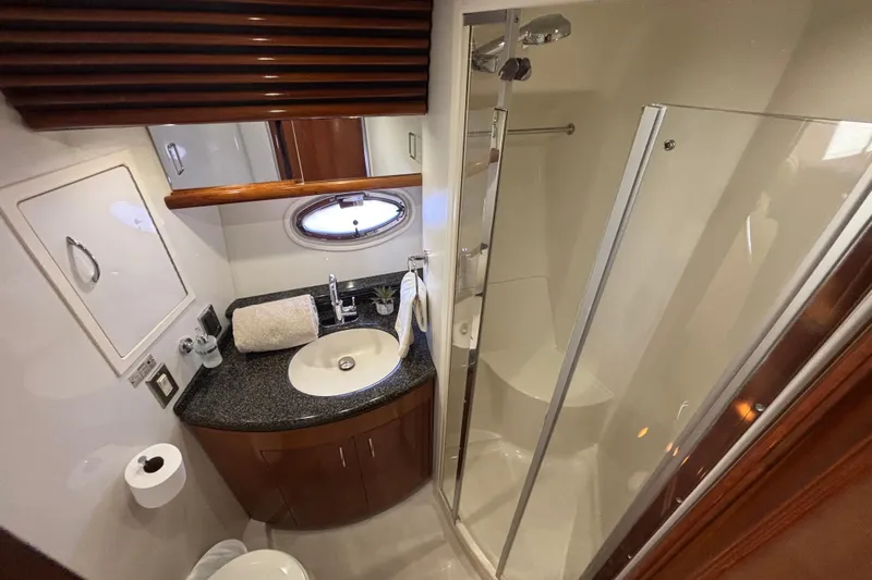 Mr & Mrs Smith Yacht Photos Pics Luxurious bathroom in 2003 Carver 450 Voyager Pilothouse yacht with modern amenities.