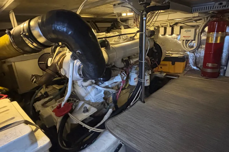 Mr & Mrs Smith Yacht Photos Pics Engine room of 2003 Carver 450 Voyager Pilothouse with visible machinery and equipment.