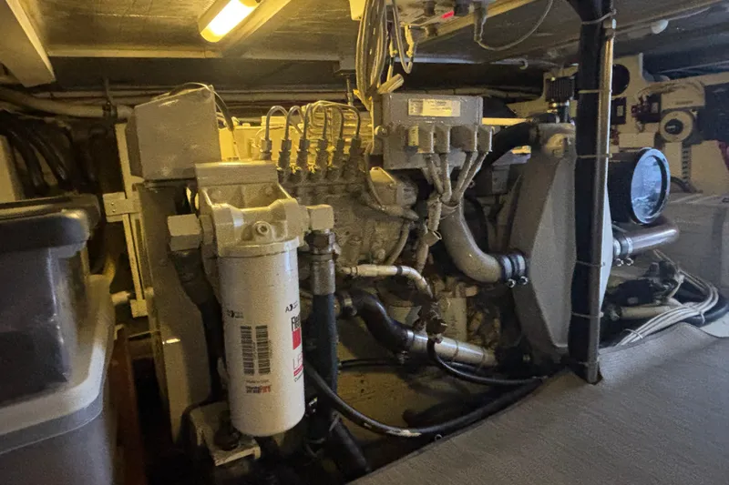 Mr & Mrs Smith Yacht Photos Pics Engine room of 2003 Carver 450 Voyager Pilothouse with visible machinery and components.