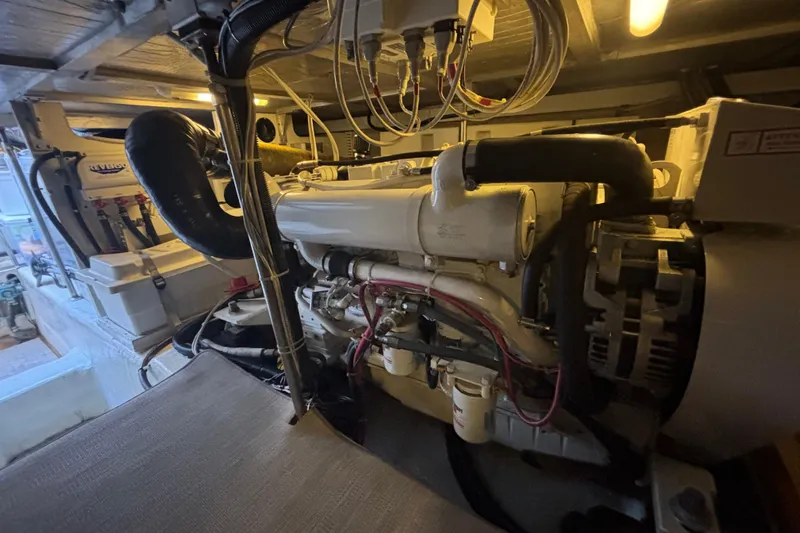 Mr & Mrs Smith Yacht Photos Pics Engine room of 2003 Carver 450 Voyager Pilothouse with visible machinery and wiring.