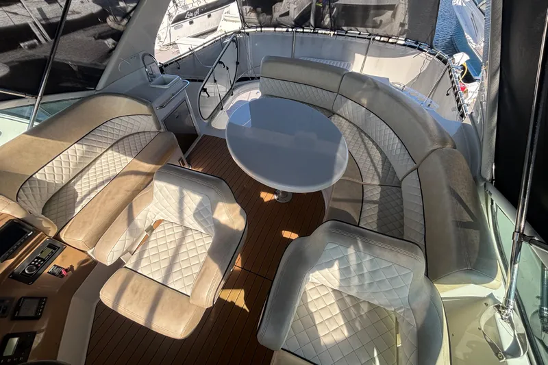 Mr & Mrs Smith Yacht Photos Pics Luxurious interior of 2003 Carver 450 Voyager Pilothouse with plush seating and elegant design.