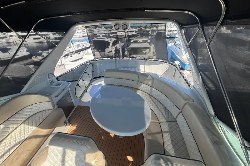 Mr & Mrs Smith Yacht Photos Pics Luxurious 2003 Carver 450 Voyager Pilothouse yacht interior with elegant seating and table.