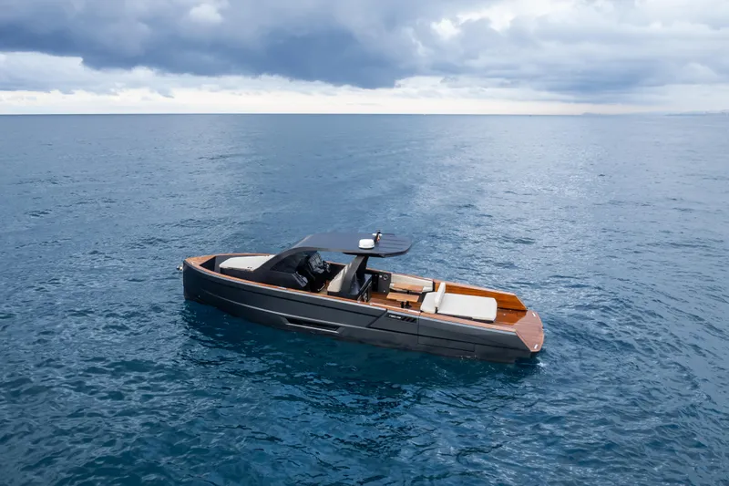 Maxim Yachts | Max43 Comfort Yacht Photos Pics 2025 Maxim Yachts 43 on open sea under cloudy sky.