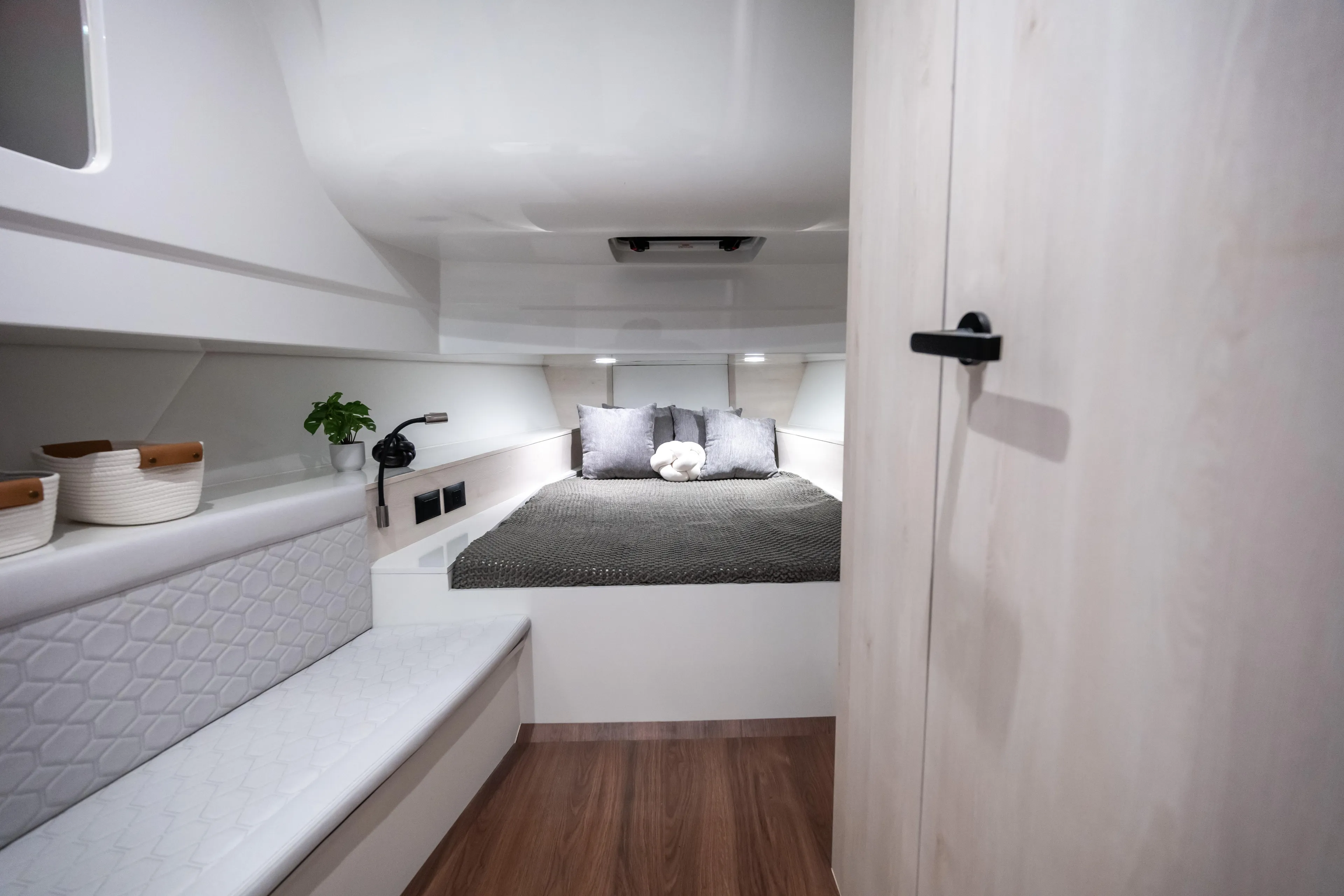 Maxim Yachts | Max43 Comfort Yacht Photos Pics Luxurious interior of 2025 Maxim Yachts 43, featuring a cozy bed and modern decor.