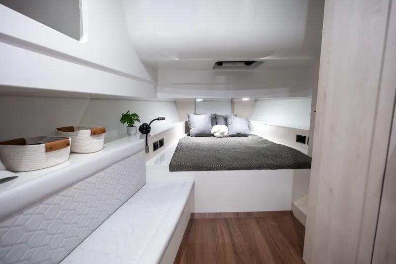 Maxim Yachts | Max43 Comfort Yacht Photos Pics Luxurious interior cabin of 2025 Maxim Yachts 43, featuring modern design and cozy bedding.