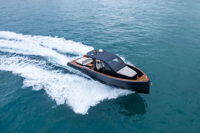 Maxim Yachts | Max43 Comfort Yacht Photos Pics 2025 Maxim Yachts 43 cruising on open water, showcasing sleek design and performance.