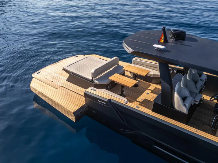 Maxim Yachts | Max43 Comfort Yacht Photos Pics 2025 Maxim Yachts 43 on calm water, featuring sleek design and spacious deck.