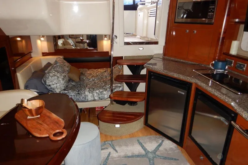 Yacht Photos Pics Interior of 2008 Sea Ray 40 Sundancer yacht with cozy cabin and modern kitchen amenities.
