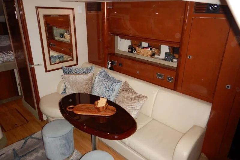  Yacht Photos Pics Luxurious interior of 2008 Sea Ray 40 Sundancer yacht with elegant seating and wooden accents.