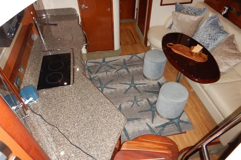  Yacht Photos Pics Luxurious interior of 2008 Sea Ray 40 Sundancer yacht with modern kitchen and cozy seating area.