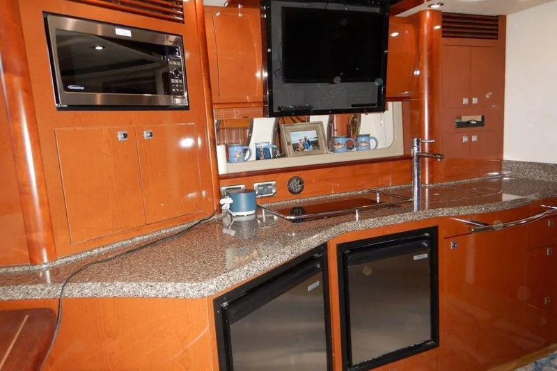  Yacht Photos Pics Luxurious kitchen interior of 2008 Sea Ray 40 Sundancer yacht with modern amenities.