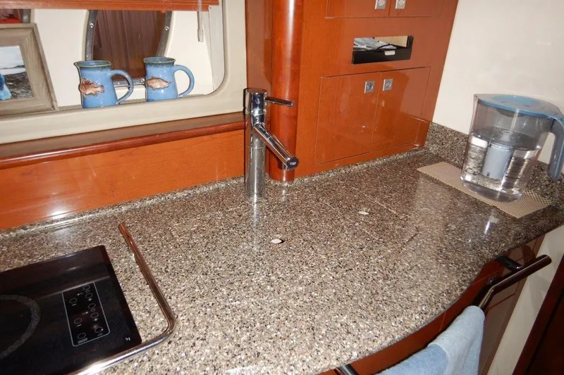  Yacht Photos Pics Luxurious kitchen area in a 2008 Sea Ray 40 Sundancer yacht with granite countertop.