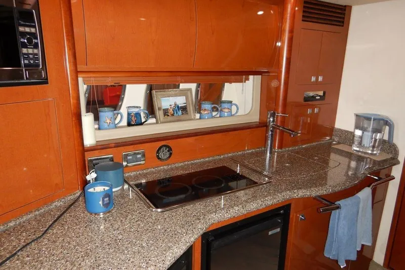  Yacht Photos Pics Luxurious kitchen interior of 2008 Sea Ray 40 Sundancer yacht with modern amenities.