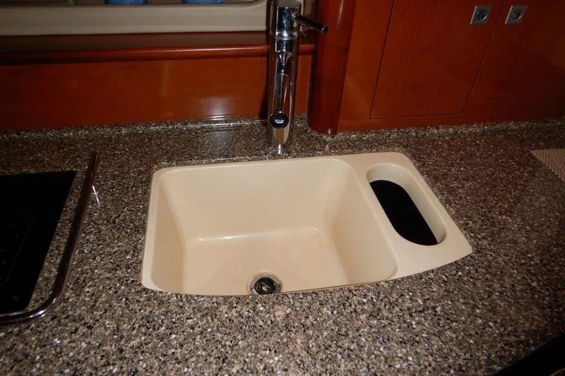  Yacht Photos Pics Kitchen sink on 2008 Sea Ray 40 Sundancer yacht with granite countertop.