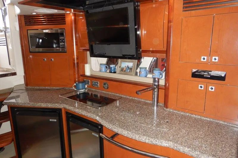  Yacht Photos Pics Luxurious 2008 Sea Ray 40 Sundancer yacht kitchen with modern appliances and sleek design.