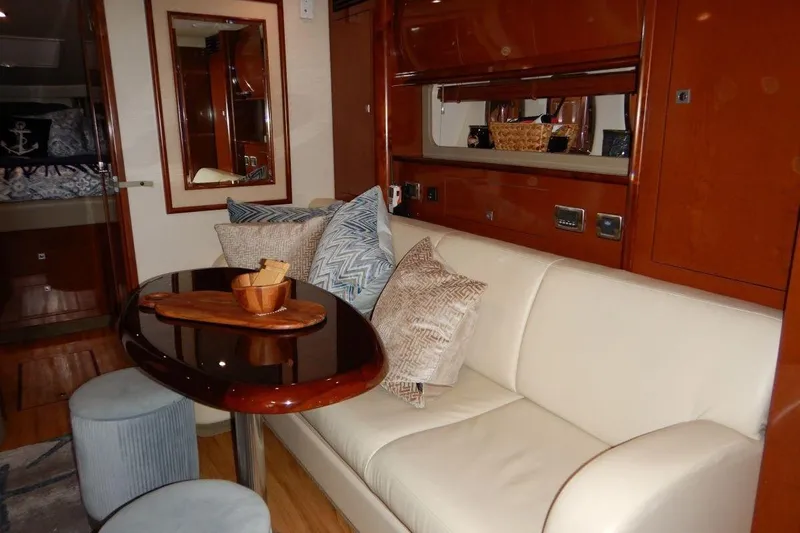  Yacht Photos Pics Luxurious interior of 2008 Sea Ray 40 Sundancer yacht with elegant seating and table.