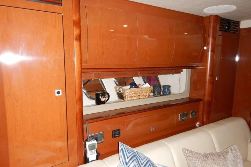  Yacht Photos Pics Luxurious interior of 2008 Sea Ray 40 Sundancer yacht with wooden cabinetry and plush seating.