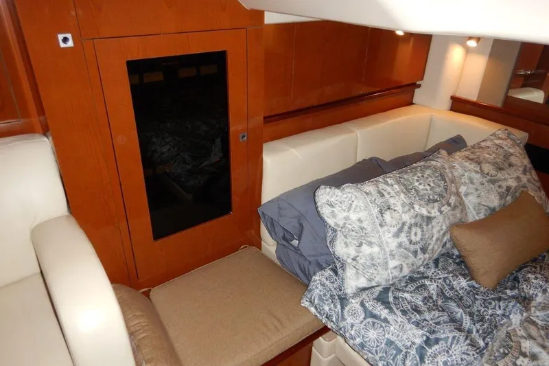  Yacht Photos Pics Luxurious interior of 2008 Sea Ray 40 Sundancer yacht with elegant bedding and wood paneling.