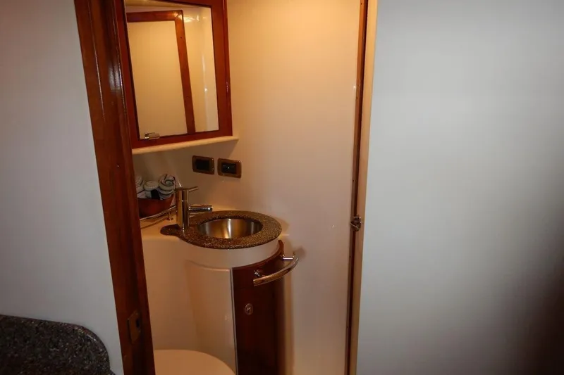  Yacht Photos Pics Compact bathroom in 2008 Sea Ray 40 Sundancer yacht with sink and mirror.