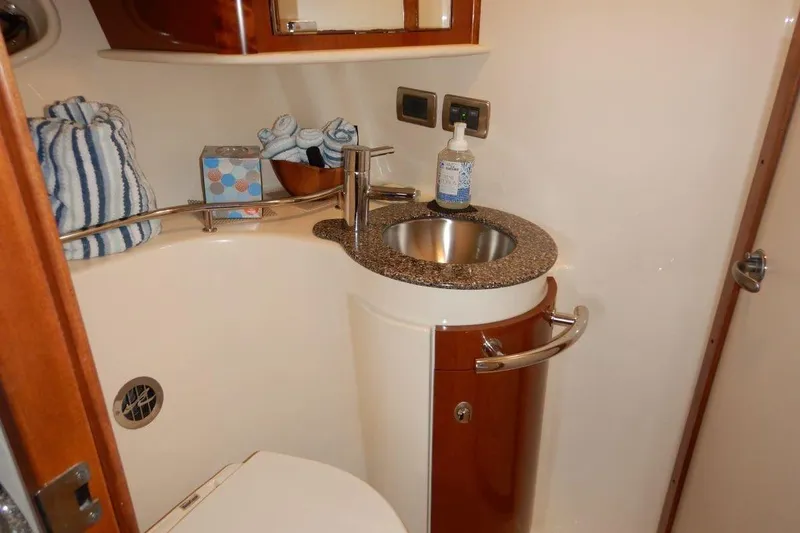  Yacht Photos Pics Luxurious bathroom in 2008 Sea Ray 40 Sundancer yacht with modern sink and amenities.