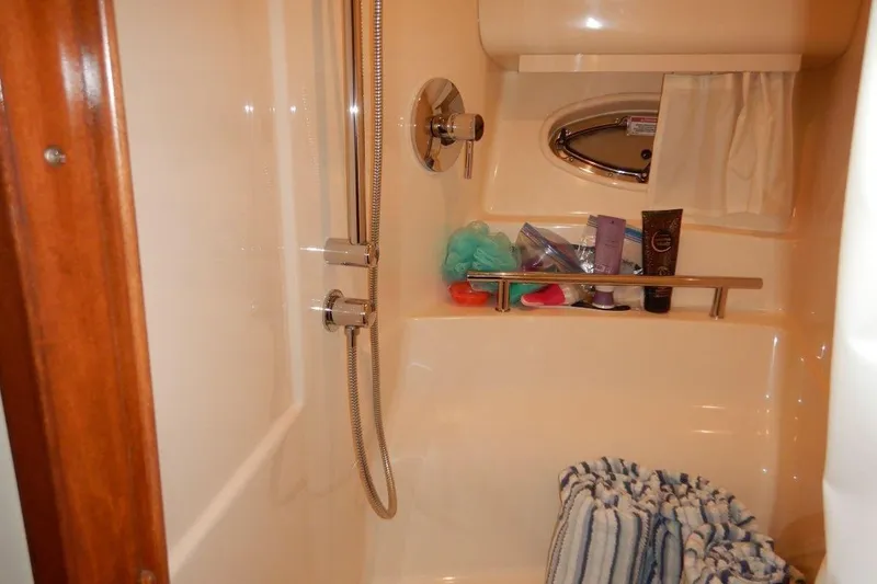  Yacht Photos Pics Shower area in 2008 Sea Ray 40 Sundancer yacht with toiletries and striped towel.