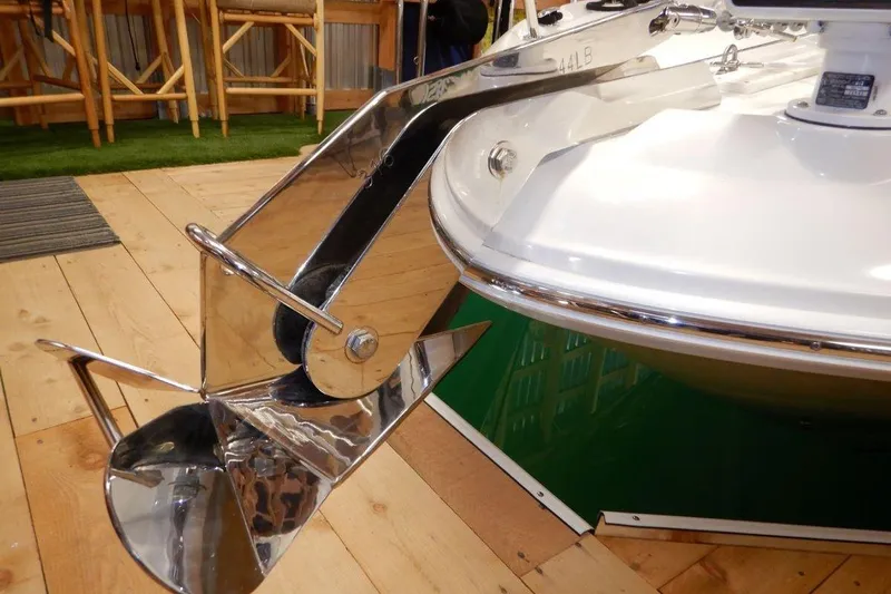  Yacht Photos Pics Polished anchor on 2008 Sea Ray 40 Sundancer yacht, displayed indoors on wooden flooring.