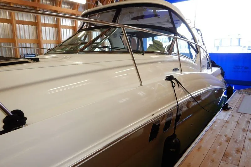  Yacht Photos Pics 2008 Sea Ray 40 Sundancer yacht docked in a wooden boathouse.