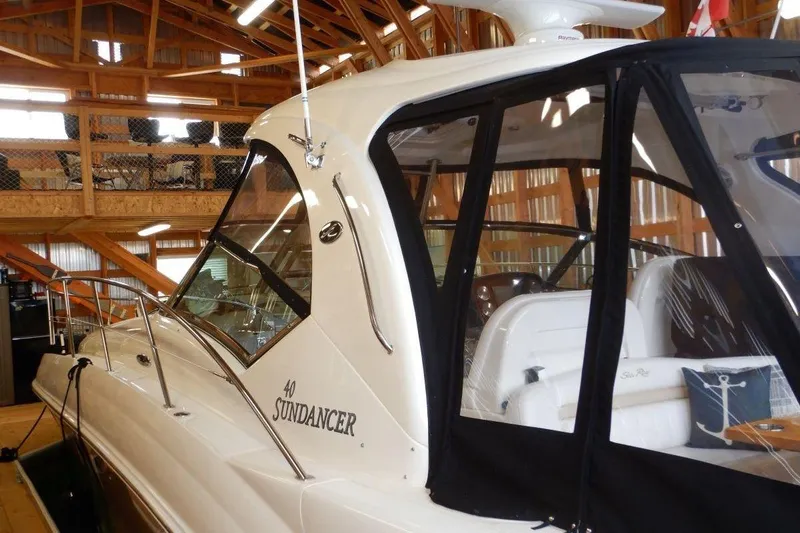  Yacht Photos Pics 2008 Sea Ray 40 Sundancer yacht in a wooden boathouse, showcasing sleek design and luxury.