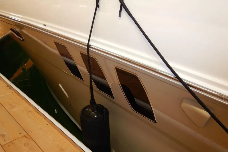  Yacht Photos Pics 2008 Sea Ray 40 Sundancer yacht side view with dock fender and windows.