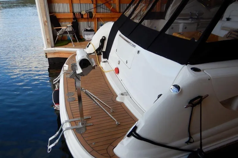  Yacht Photos Pics 2008 Sea Ray 40 Sundancer docked, showcasing rear deck and water view.