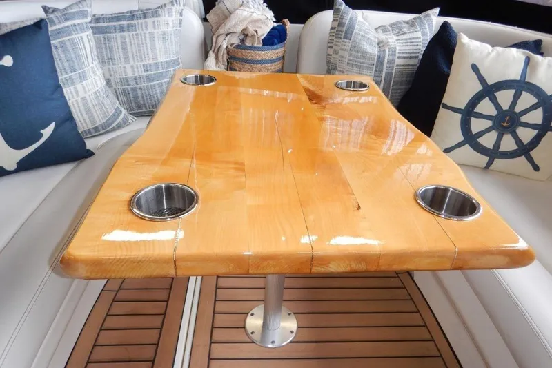  Yacht Photos Pics Luxurious wooden table with cup holders on a 2008 Sea Ray 40 Sundancer yacht.
