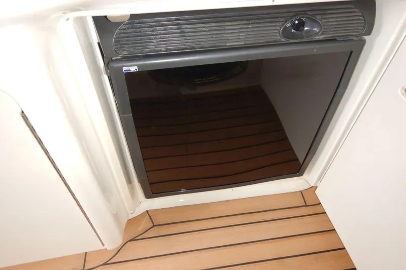  Yacht Photos Pics Built-in refrigerator on 2008 Sea Ray 40 Sundancer yacht with wooden flooring.
