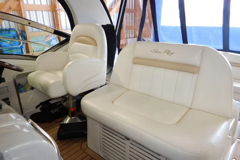  Yacht Photos Pics 2008 Sea Ray 40 Sundancer interior with white leather seating and helm chair.