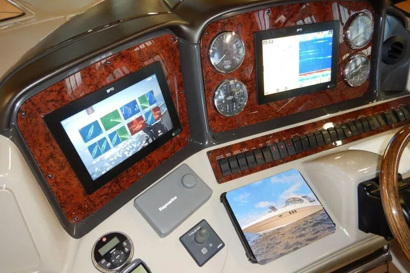  Yacht Photos Pics Dashboard of a 2008 Sea Ray 40 Sundancer with navigation screens and controls.
