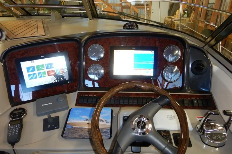  Yacht Photos Pics Dashboard of a 2008 Sea Ray 40 Sundancer with navigation screens and controls.