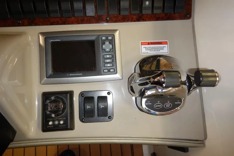  Yacht Photos Pics Control panel of a 2008 Sea Ray 40 Sundancer boat with throttle and display.