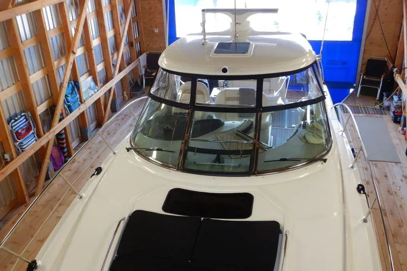  Yacht Photos Pics 2008 Sea Ray 40 Sundancer yacht in a wooden boathouse, viewed from above.