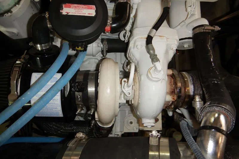  Yacht Photos Pics Engine components of a 2008 Sea Ray 40 Sundancer boat, featuring hoses and mechanical parts.