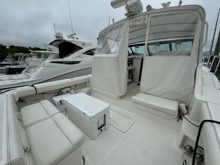 Vixen Yacht Photos Pics 2002 Tiara Yachts 3500 Express boat with spacious deck and seating area.