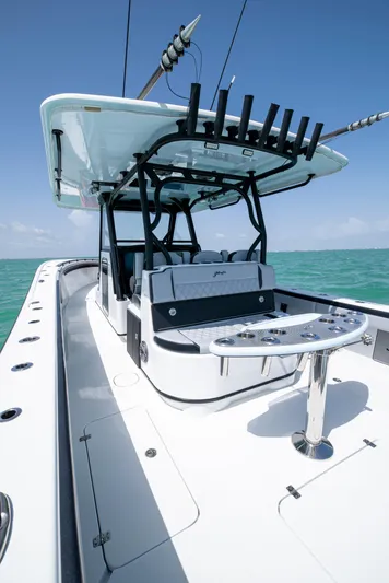  Yacht Photos Pics 2022 Yellowfin 39 boat with sleek design, spacious deck, and fishing rod holders.