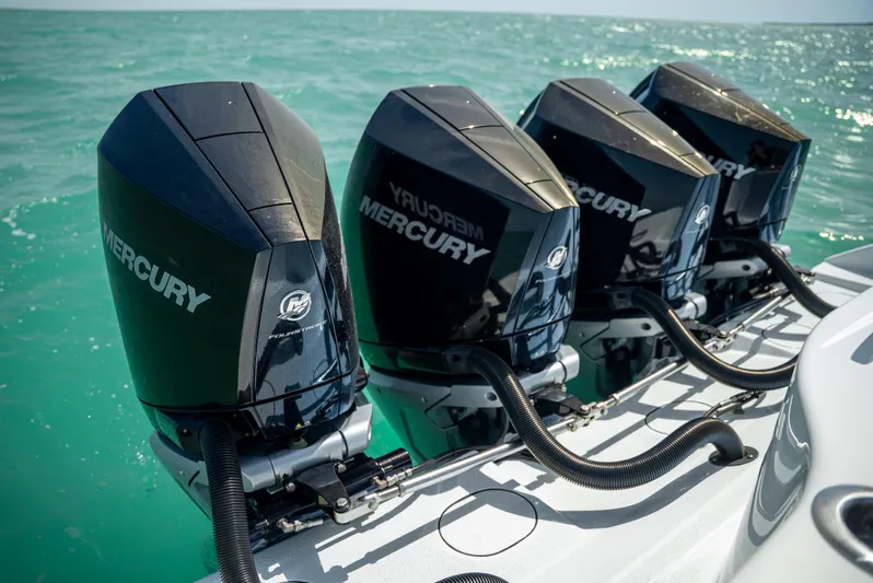  Yacht Photos Pics Four Mercury outboard engines on a 2022 Yellowfin 39 boat in turquoise waters.