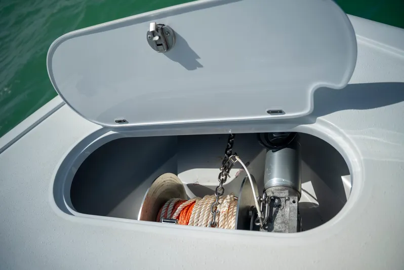  Yacht Photos Pics Anchor storage compartment on 2022 Yellowfin 39 boat, featuring rope and chain.