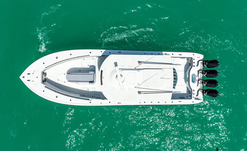  Yacht Photos Pics Aerial view of 2022 Yellowfin 39 boat on turquoise water.
