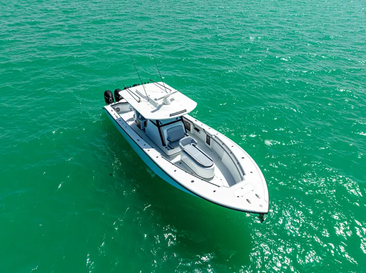  Yacht Photos Pics 2022 Yellowfin 39 boat on turquoise water, aerial view.