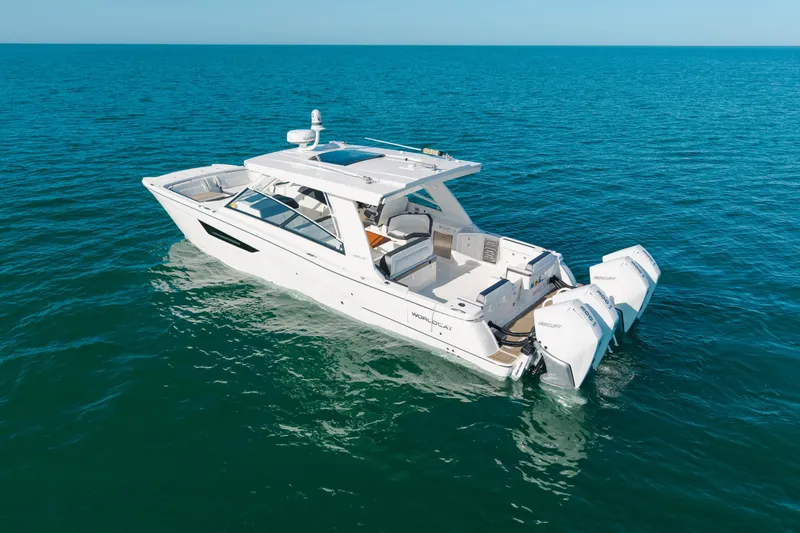  Yacht Photos Pics 2024 World Cat 400 DC-X boat on open sea, featuring dual Mercury engines.