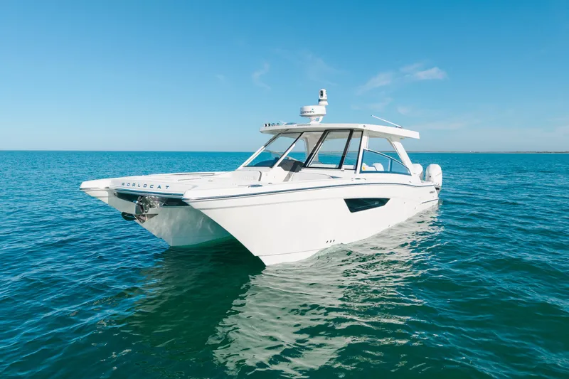  Yacht Photos Pics 2024 World Cat 400 DC-X boat on calm blue ocean waters.