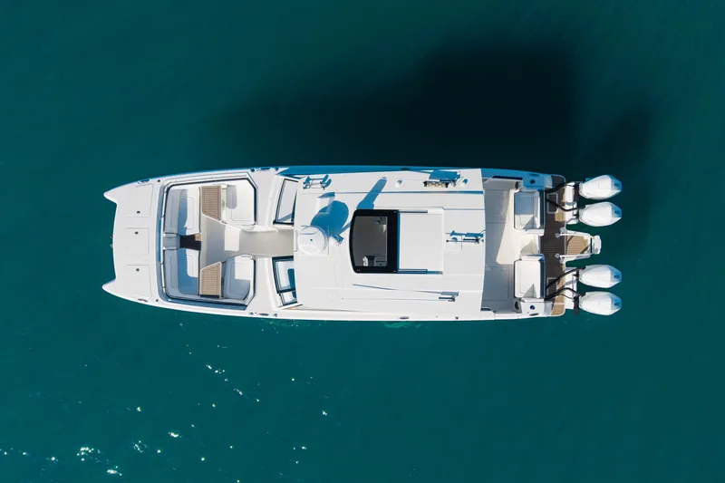  Yacht Photos Pics Aerial view of 2024 World Cat 400 DC-X boat on clear blue water.