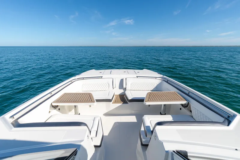  Yacht Photos Pics 2024 World Cat 400 DC-X boat interior with ocean view, featuring seating and tables.